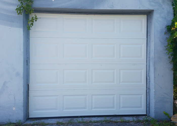 New white raised-panel garage door installed by Atlantic Ocean Garage Doors