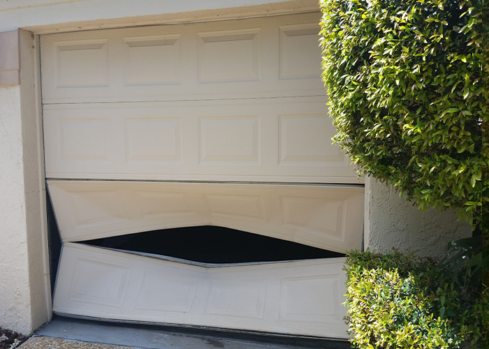 Garage door crushed and buckled before replacement